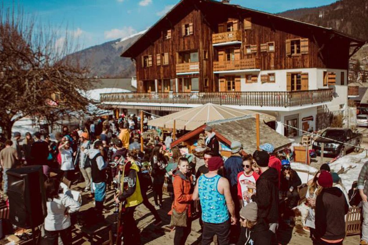 people enjoying a BBQ on a terrace at a hotel in morzine