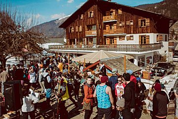 people enjoying a BBQ on a terrace at a hotel in morzine