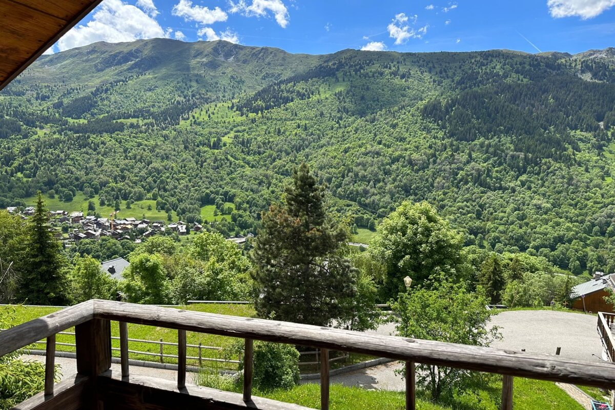 A view of a mountain range from a balcony