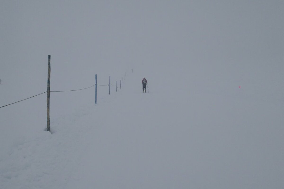 a ski tourer in the mist