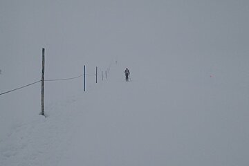 a ski tourer in the mist