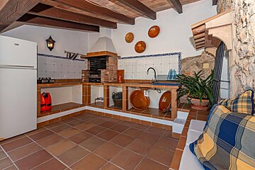 A kitchen with a beko refrigerator in the corner