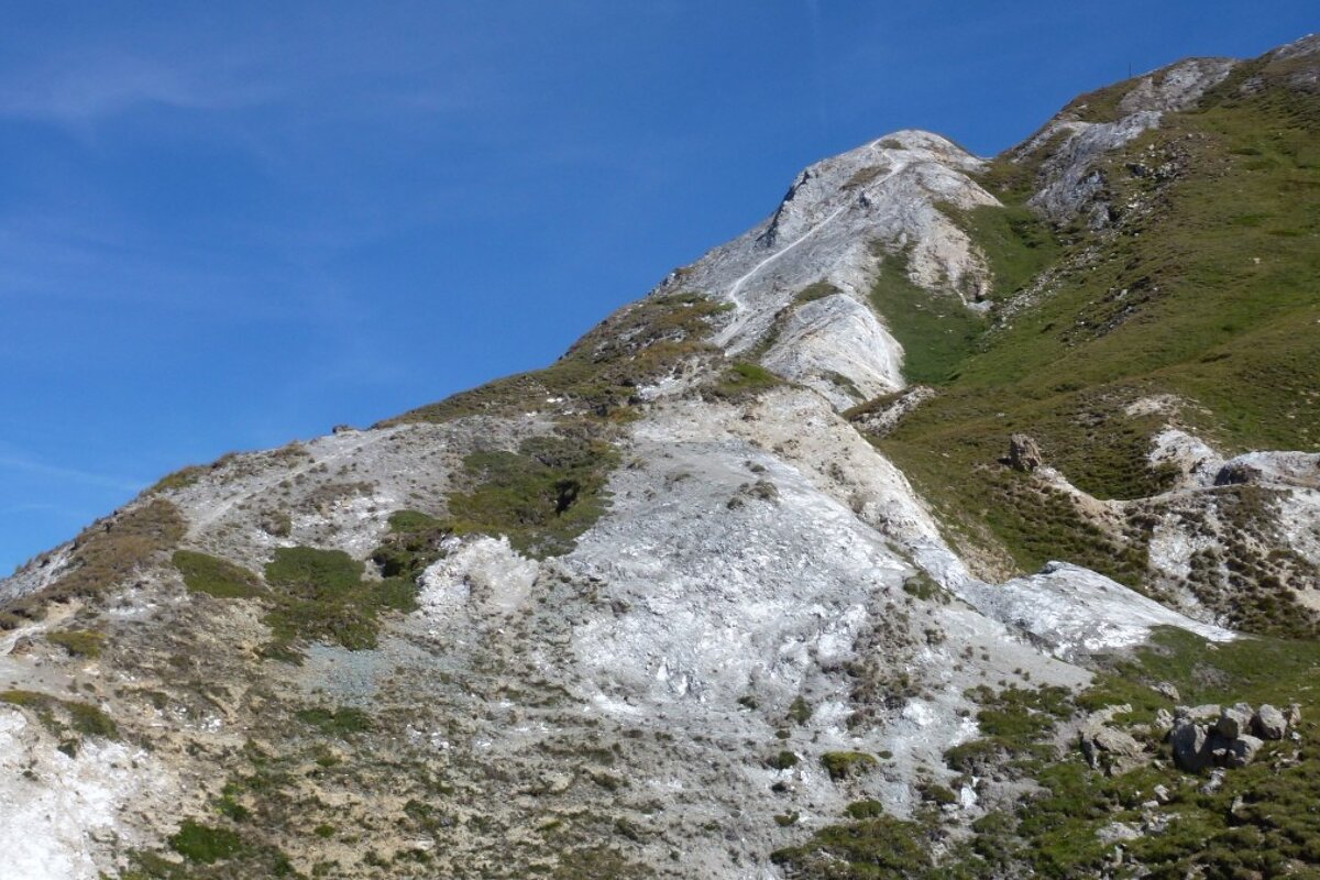 a barely visible mountain bike trail in tignes bike park