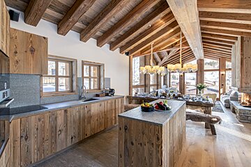 A kitchen with wooden cabinets and granite counter tops