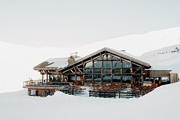 A snow covered building with a lot of windows