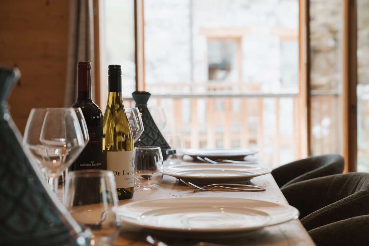 A bottle of cabernet sauvignon sits on a table
