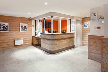 A reception area with a fire extinguisher on the wall