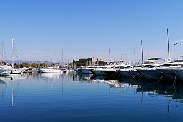 yachts in port vauban with fort carre in background