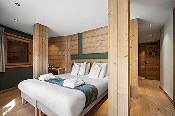 A bedroom with a bed and a sign that says ' hotel ' on it