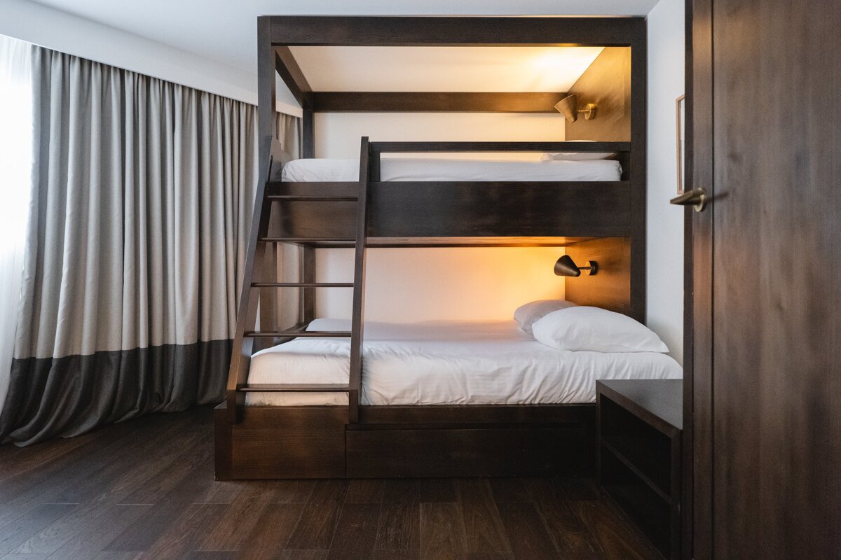 A bunk bed with a ladder leading up to it