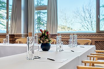 A bottle of aquafina water sits on a table