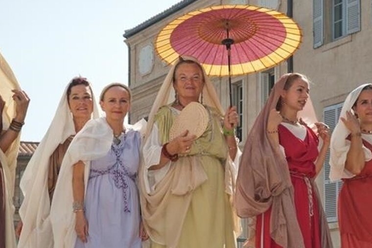 women dressed in Roman costumes