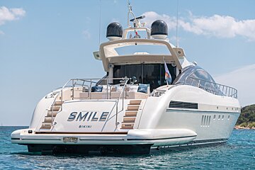 A yacht with the name smile bikini on the back