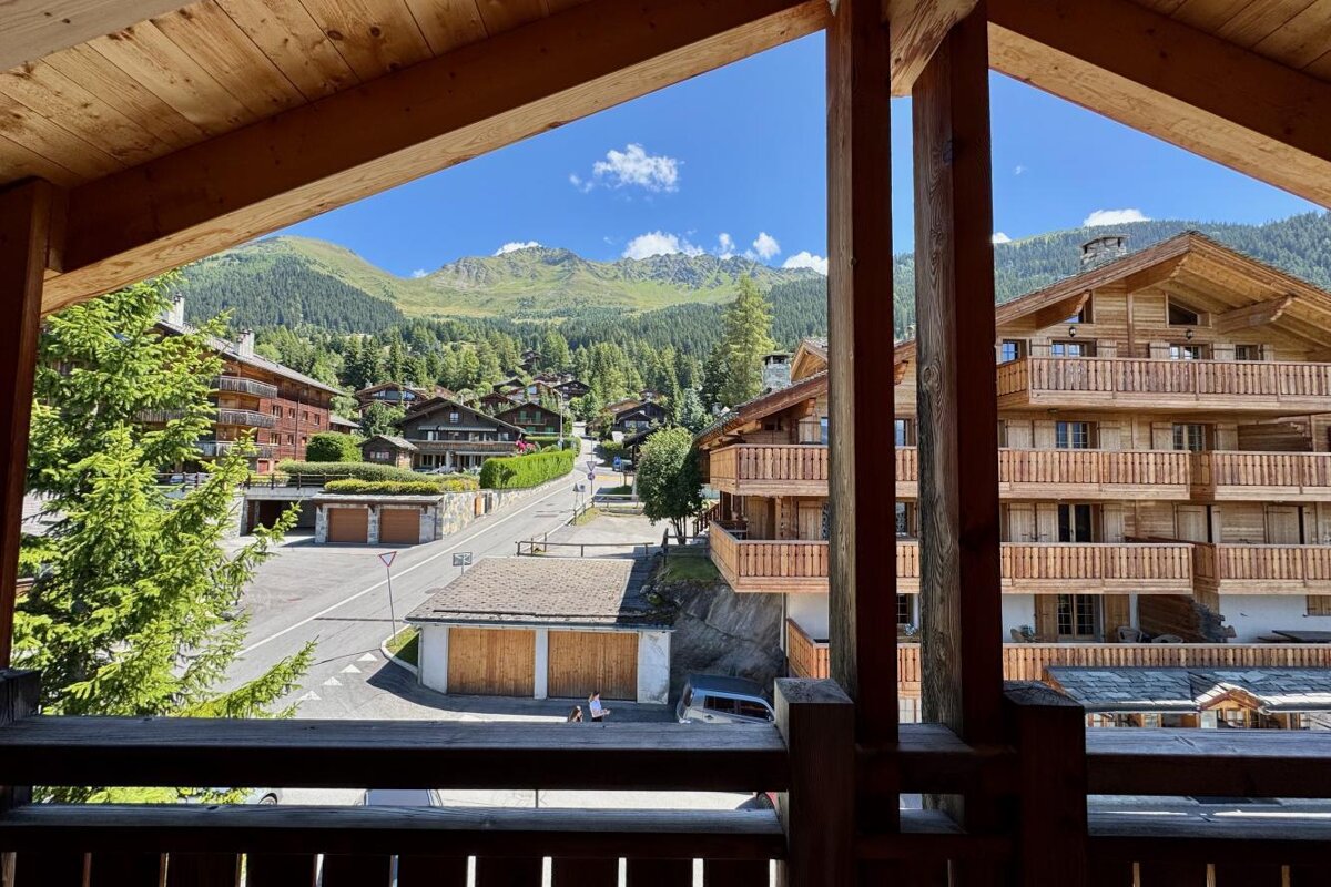 A view of a mountain village from a balcony