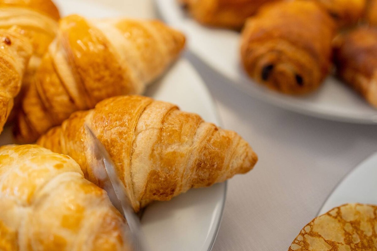 A close up of a croissant on a plate