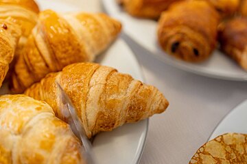 A close up of a croissant on a plate