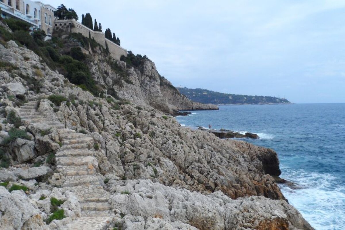 stone steps leading from buildings to the sea