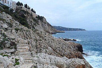 stone steps leading from buildings to the sea