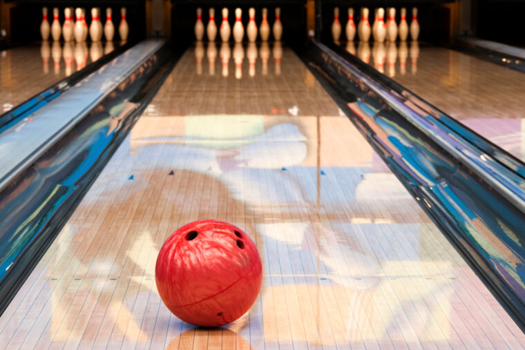 a bowling ball and pins on a bowling lane