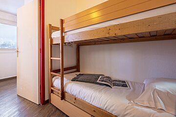 A bunk bed with a book on top of it