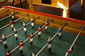 a table football table in a bar