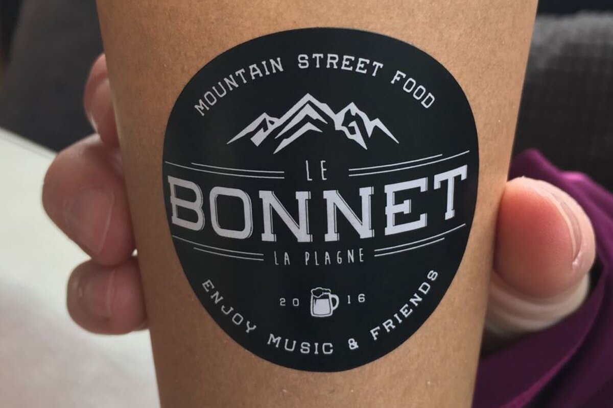 someone holding a coffee cup