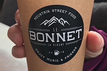 someone holding a coffee cup