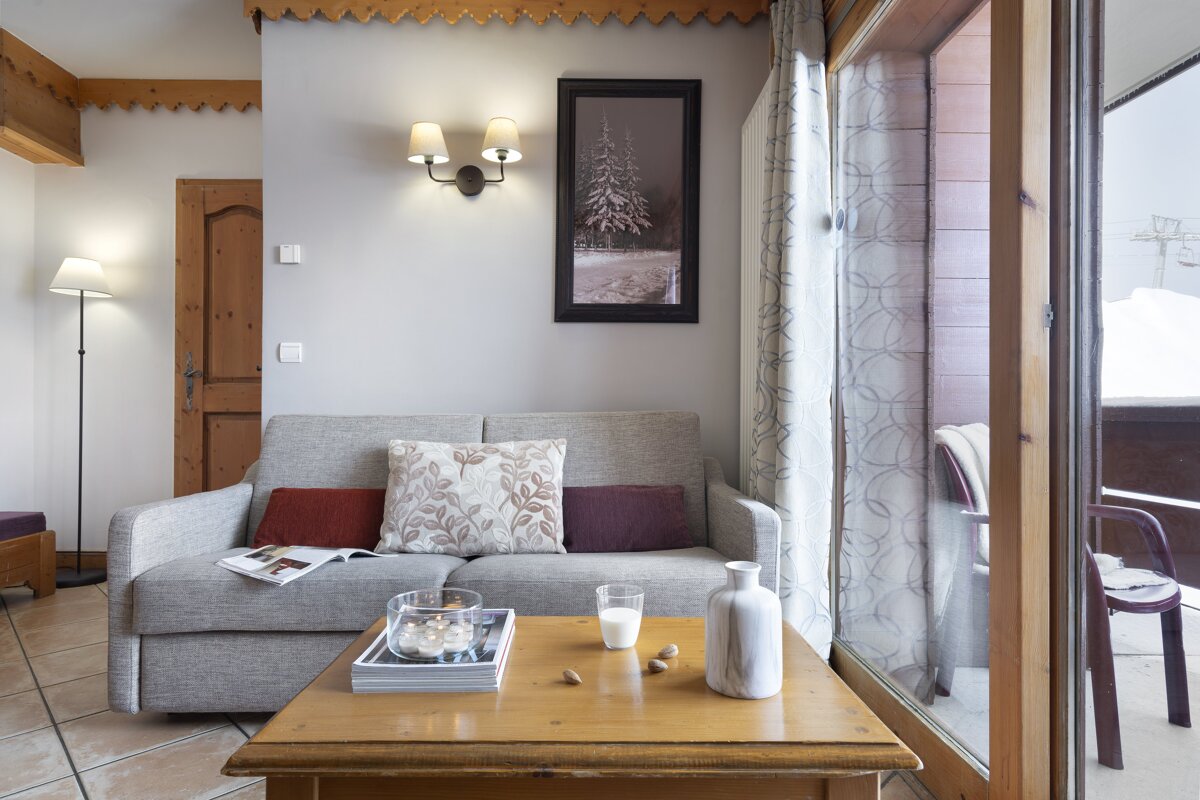 A living room with a couch and a coffee table