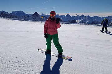 a woman on a snowboard
