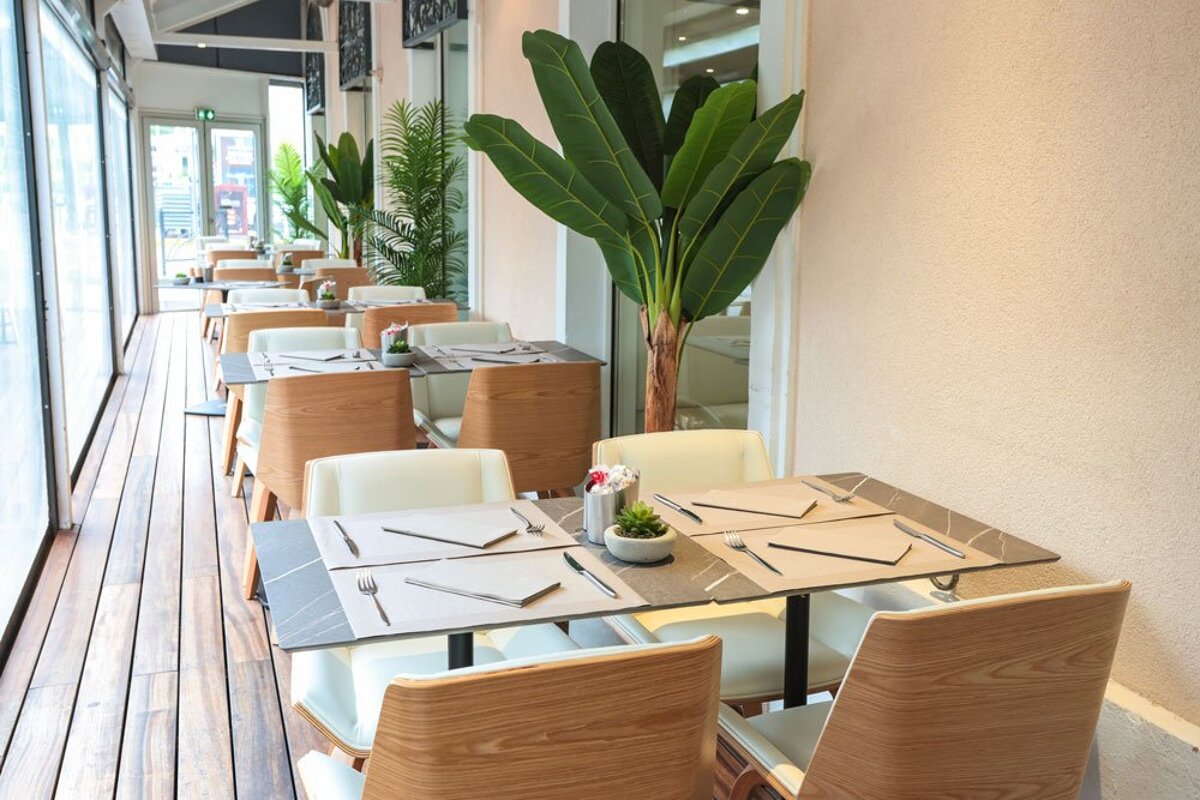 A row of tables and chairs in a restaurant