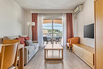 A living room with a couch and a flat screen tv