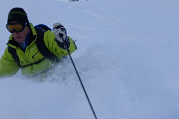 a skier in waist deep snow