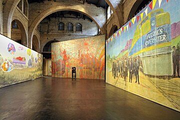 A large room with a painting of a train that says puzzle 's overnitter