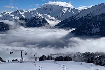 Making ski tracks in the snow in Courchevel