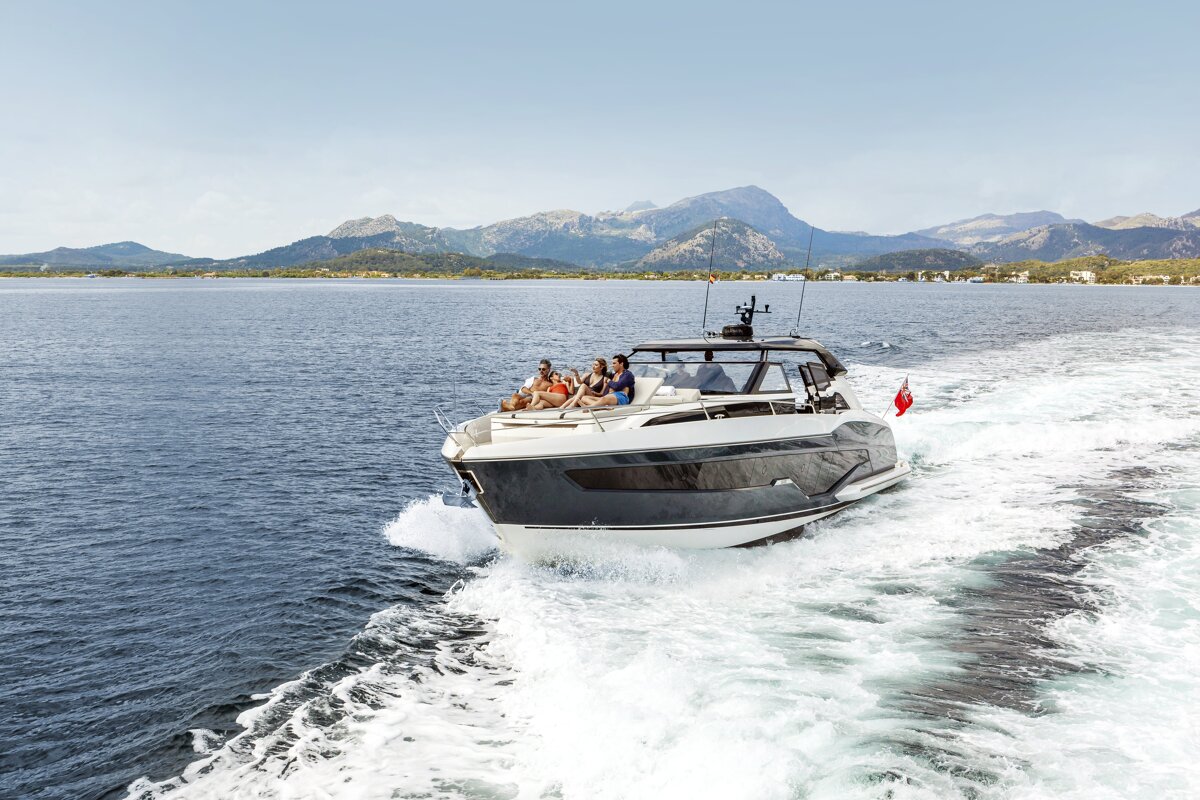 A group of people are on a boat in the ocean