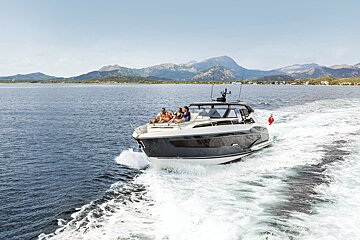 A group of people are on a boat in the ocean