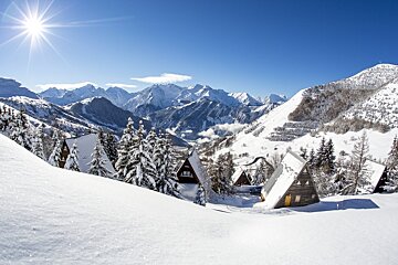 Snow covered chalets in the mountains