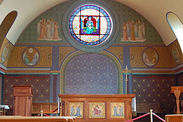 a colourful fresco at the alter of a church