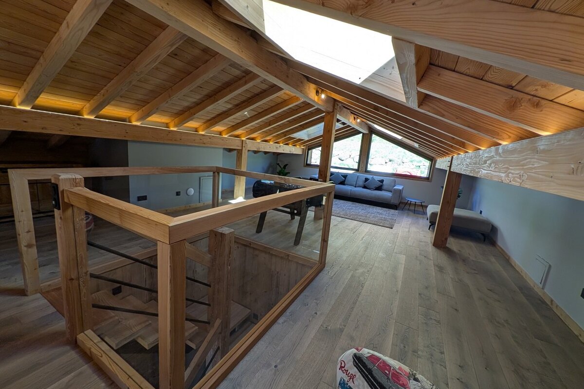 A wooden staircase leading up to the second floor of a house