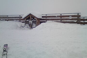 snow covered railings