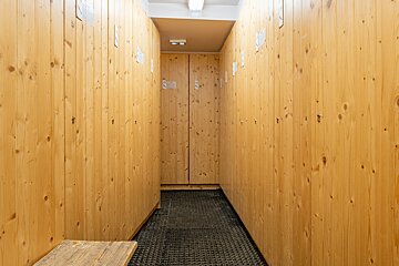 A row of wooden lockers with the numbers s and s on them