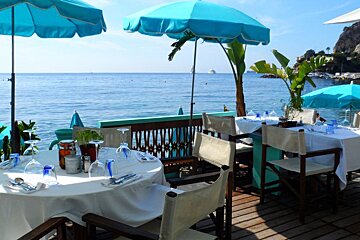 blue parasols and restaurant tables