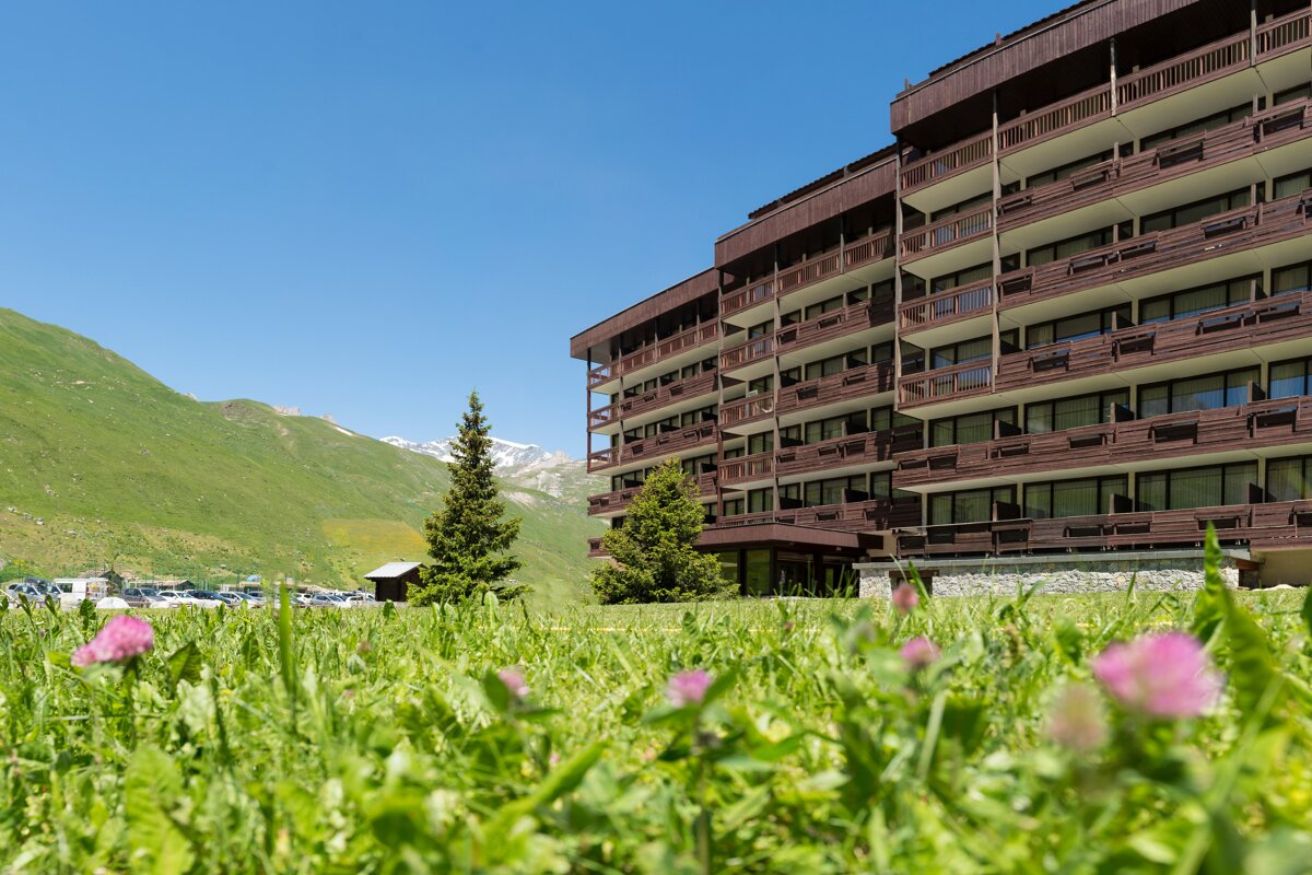 A large building with a lot of windows and balconies