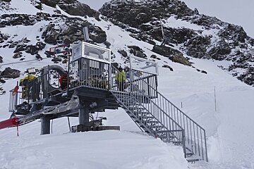a boy standing on a platform ready for a zip wire