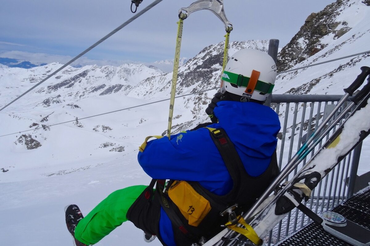 a skier about to set off on a zip line