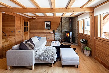 A living room with a couch and a fireplace