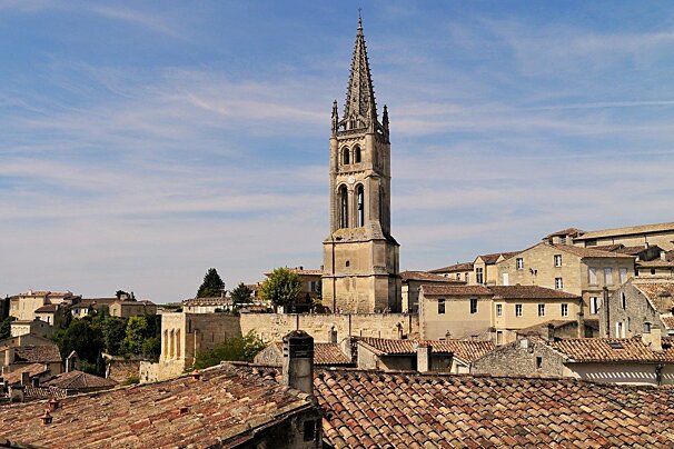 view over rooftops to the church monlithe