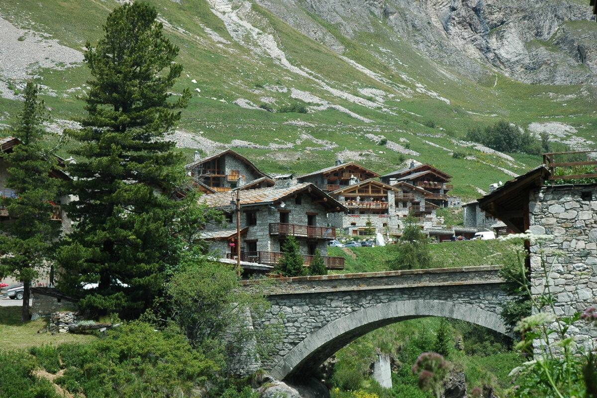 A stone bridge in the middle of a mountain village