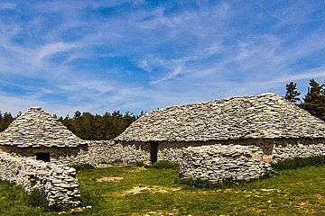 A stone building with a blue sky in the background