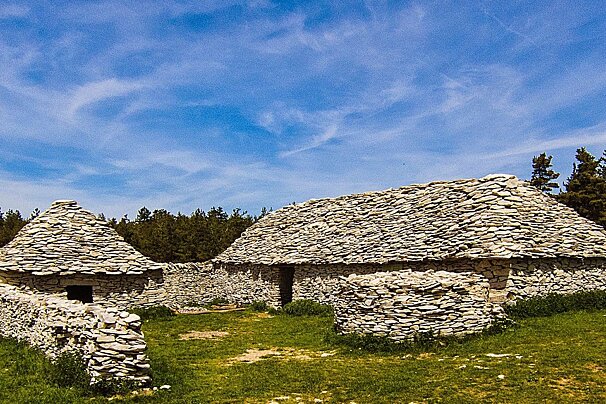 A stone building with a blue sky in the background